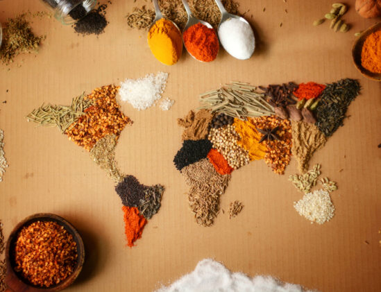 A world map made from spices used in kitchen